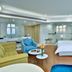 Parkyard Hotel Jiaxing in Jiaxing guest room with twin beds, blue accent wall, and seating area