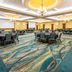 Drury Plaza Hotel St. Louis Chesterfield ballroom with round banquet tables and teal patterned carpet