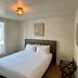 Villa Montmartre - Nouvellement Rénové hotel room in Paris with bed, window light, and wall art