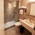 Fairfield Inn & Suites by Marriott New York Brooklyn bathroom with glass shower, sink, and toilet