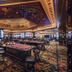 Soho Hotel & Casino at Sun City Resort casino floor with gaming tables and colorful patterned carpet