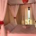 Pousada Mar de Araçatiba bedroom with canopy bed and sea view through curtains in Vila do Abraao