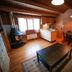Vesterland Feriepark Cabins & Apartments in Sogndal, wood-paneled cabin with fireplace and kitchen