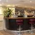 Montcalm Brewery Townhouse in London bar with red stools and backlit liquor shelves