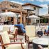 Outdoor resort patio at Omni Rancho Las Palmas Resort & Spa in Rancho Mirage with lounge chairs and umbrellas