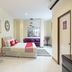 OYO 1134 Baan Zarn Guesthouse Patong room with bed, sofa and dining area