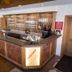 Hotel Landgasthof Hohenauer Hof bar and reception area in Hohenau with wooden counter and drink shelves