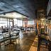 Econo Lodge Ormond Beach North - Daytona bar and dining area in Ormond Beach with tables and stools