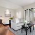 Gaige House in Glen Ellen living area with sofa, coffee table, and open French doors to a garden