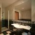 Hostellerie Les Hauts De Sainte Maure bathroom with walk-in shower, sink, and large mirror in Sainte-Maure-de-Touraine