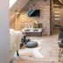 Silverton in Białka Tatrzańska attic room with exposed brick wall, TV, desk, and dining chairs