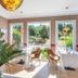 Manoir de la Poterie & Spa in Honfleur lounge with garden views through large windows and table settings
