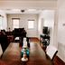 Blue Moon Guest House in Lafayette dining area with sofa seating and TV in a bright room