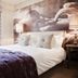 The White Swan Hotel in Stratford-upon-Avon bedroom with horse mural, bedside lamps and plush bed