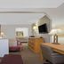 Super 8 by Wyndham Port Royal/Beaufort guest room with sofa, desk, dresser and TV in Port Royal