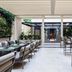 Worldhotel Cristoforo Colombo, Milan: covered outdoor dining area with tables, chairs and greenery