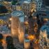 Sultan Inn Boutique Hotel in Baku with illuminated stone tower and cityscape at dusk