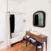 The Borland House Inn bathroom in Montgomery with clawfoot tub, toilet, vanity and wood floors