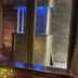 Ashbys Accommodation & Spa hire Portsmouth spa reception with mosaic-tiled pillars and blue lighting