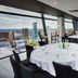 The Cube Hotel Birmingham rooftop restaurant with city views and set dining tables in Birmingham