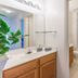 Villas at Seven Dwarfs Lane Resort in Kissimmee bathroom with vanity, mirror, and shower curtain
