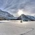 Landhotel Binderhäusl Garni in Inzell with snowy mountain valley and sunlit winter landscape
