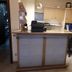 Jaegerstube in Görgeshausen reception desk with counter, office chair and welcome wall sign