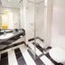 Fletcher Hotel-Restaurant De Buunderkamp bathroom in Wolfheze with walk-in shower and black-and-white tile
