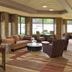 Four Points by Sheraton Milwaukee North Shore lobby lounge in Brown Deer with seating and large windows