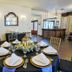 Swantown Inn & Spa in Olympia dining room with set table, wood floors, chandelier and mirror