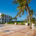Golden Tulip Dar Es Salaam terrace with palm trees and ocean view in Dar Es Salaam