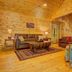 Paradise Hills, Winery Resort & Spa in Blairsville: rustic wood-paneled lounge with sofas, chairs and staircase