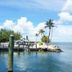 Banana Bay Resort & Marina in Marathon with a marina dock, palm trees, and calm blue water