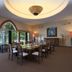 Diamonds Malindi in Malindi dining room with tables, chairs, large windows and a decorative ceiling light