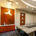 Fairfield Inn & Suites by Marriott New York Brooklyn meeting room with long conference table and black chairs