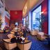 Millennium Hotel Sirih Jakarta lobby lounge in Jakarta with tall windows, piano, and seating area