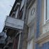 Alvares Cabral Guest House in Porto, street view with ornate facade and hanging sign