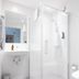 Go Hotel Østerport Copenhagen bathroom with glass shower, sink and white tile interior