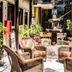 Hotel Royal Qosqo in Cusco: indoor courtyard with wicker chairs and a central fountain