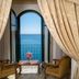 Hotel Lido Mediterranee in Taormina with arched doors opening to a sea-view balcony