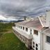 Lapland Hotels Kilpis in Kilpisjarvi, exterior with lake view and cloudy sky
