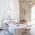 Sunstar Hotel Piemont in Asti, elegant event room with round table, white drapes and arched windows