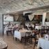 Hotel Icon Győr restaurant with tables, chairs, and arched stone ceiling interior