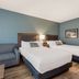 SureStay Plus by Best Western Highland Poughkeepsie guest room with two beds and a sofa