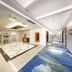 The Greenway Hotel Xiamen lobby and long blue-carpeted corridor in Xiamen