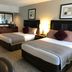 Shilo Inn Suites Hotel - Killeen guest room with two beds and a vanity desk