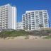 Diaz Hotel & Resort in Mossel Bay, beachfront high-rise hotel buildings above the sandy shore
