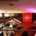 Hotel Tahiti Nui in Papeete lobby with stage, grand staircases and pink ceiling lighting