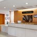 Hotel Az Kumamoto Arao Ten lobby front desk in Arao with wood-paneled reception and marble counter