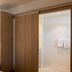 Hôtel Restaurant Au Boeuf in Blaesheim features a compact room with wood wardrobe and open bathroom door.